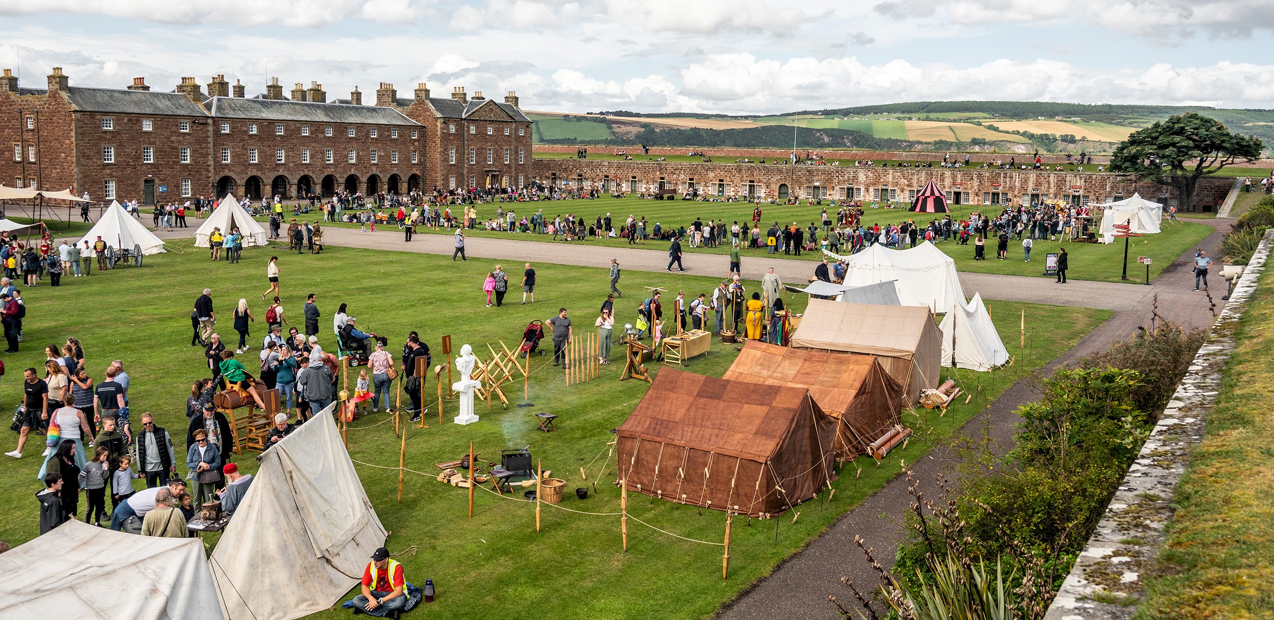 A living history camp dating back to Picts and Romans with lots of visitors milling around