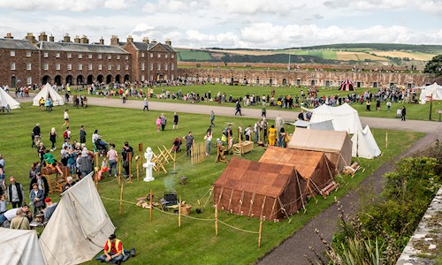A living history camp dating back to Picts and Romans with lots of visitors milling around