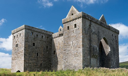 General view of Hermitage Castle with blue skies above