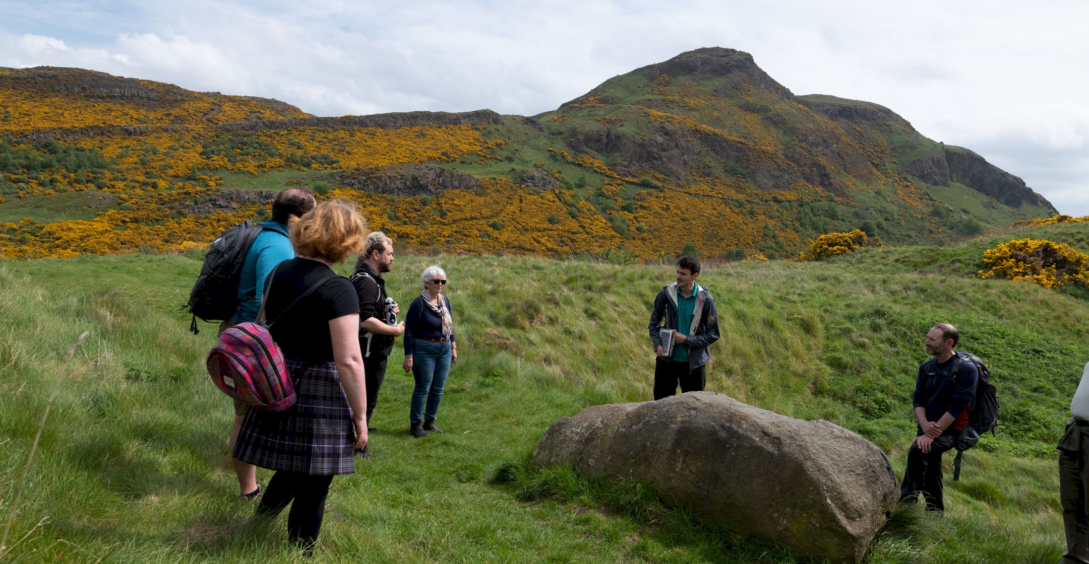 A Ranger talking to a group during a tour of Arthur's Seat