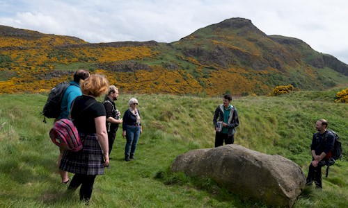 A Ranger talking to a group during a tour of Arthur's Seat
