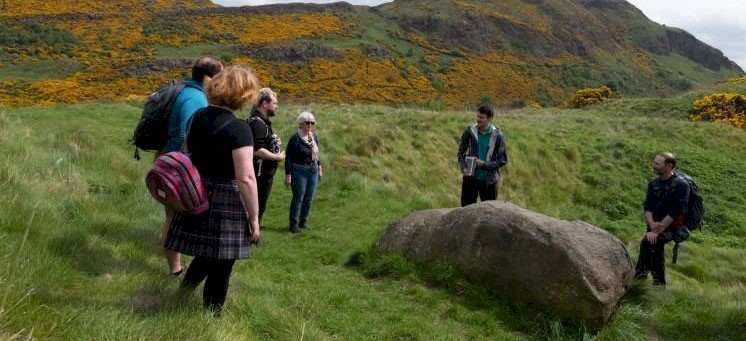 A Ranger talking to a group during a tour of Arthur's Seat