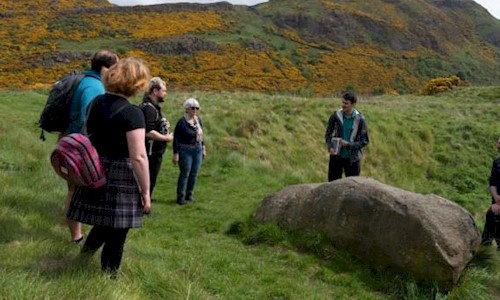 A Ranger talking to a group during a tour of Arthur's Seat