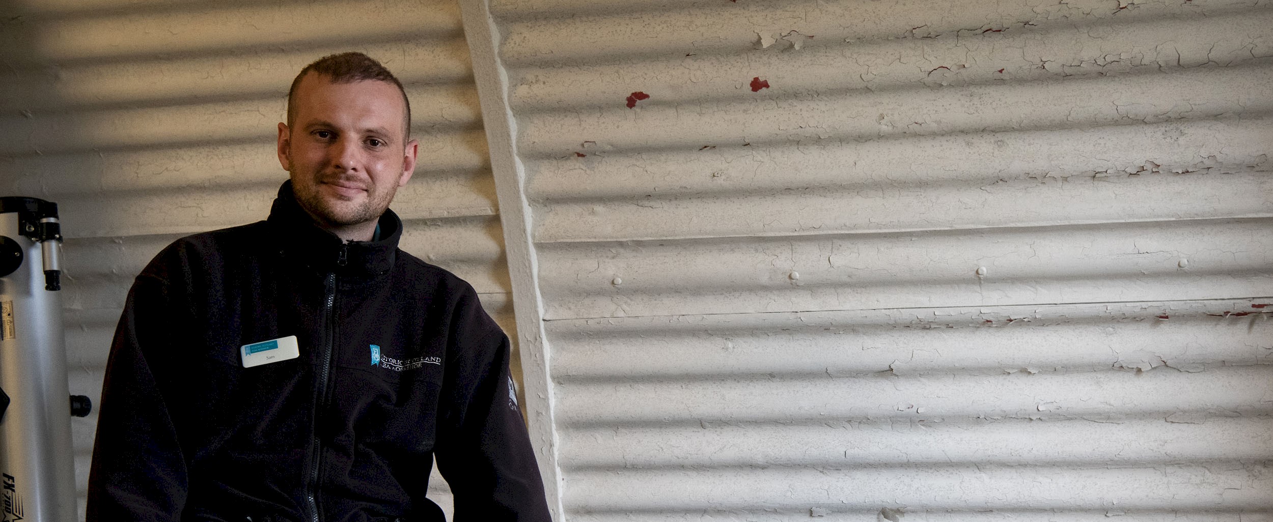 A member of staff smiling for the camera