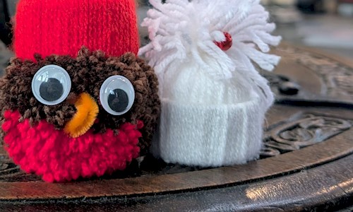 Two woolly Christmas tree decorations, a Robin and a santa hat 