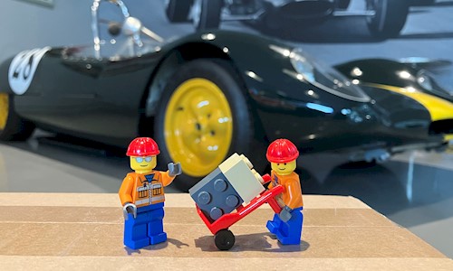 Two lego figures in front of one of the cars in the Jim Clark Motorsport Museum