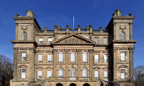 Exterior view of a splendid baroque mansion bathed in blue sky