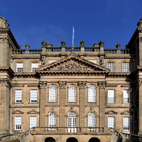 Exterior view of a splendid baroque mansion bathed in blue sky