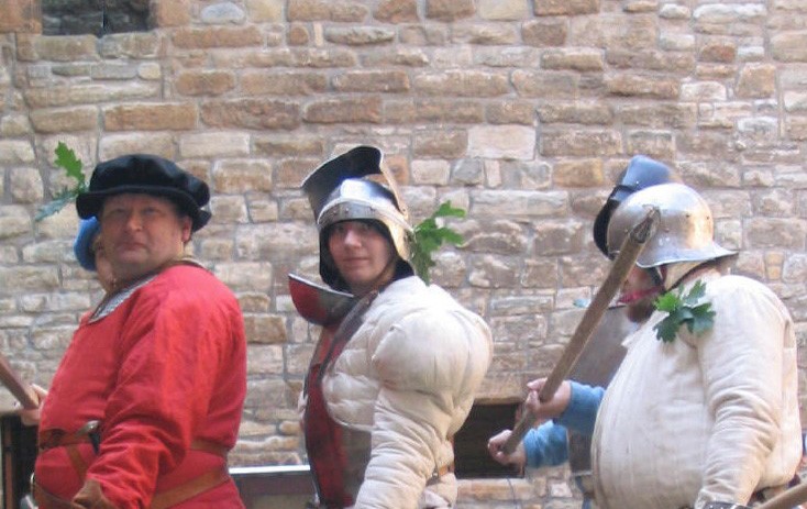 Three of the Linlithgow Players actors in costume posing for the camera
