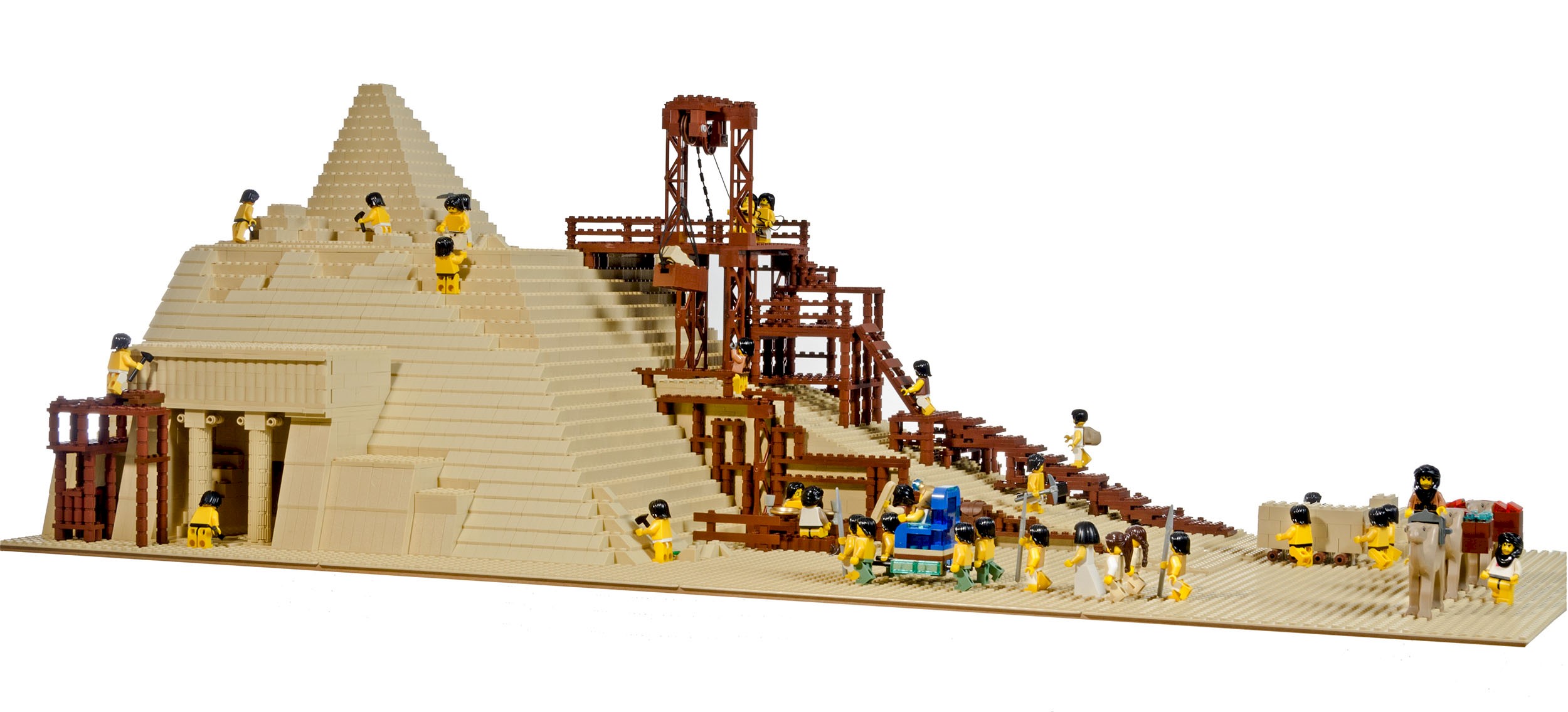 A lego pyramid with scaffolding and lego figures working on the pyramid
