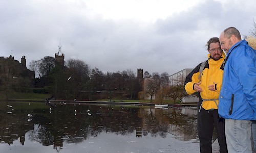 Ranger and members of the public by Linlithgow Peel
