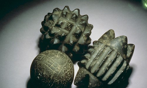 Three carved stone balls