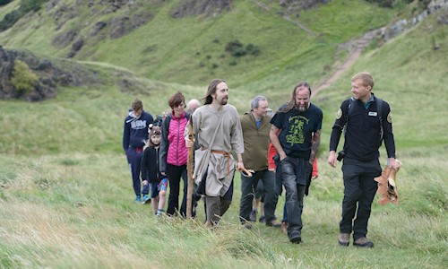 People on a guided walk with a Ranger in Holyrood Park