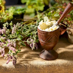 Some flowers and herbs in a mortal and pestle