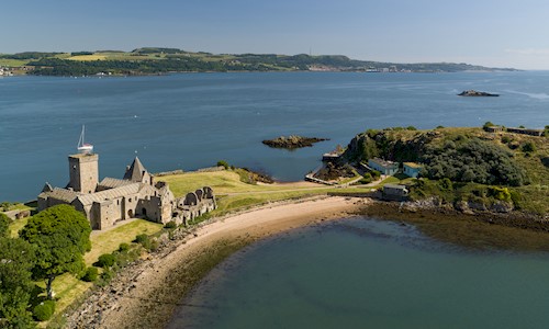 Aerial view of a beautiful abbey and island dominating the Firth of Forth