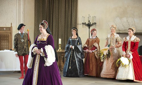 Costumed performers in Stirling Castle Great Hall dressed as Ladies of the Court