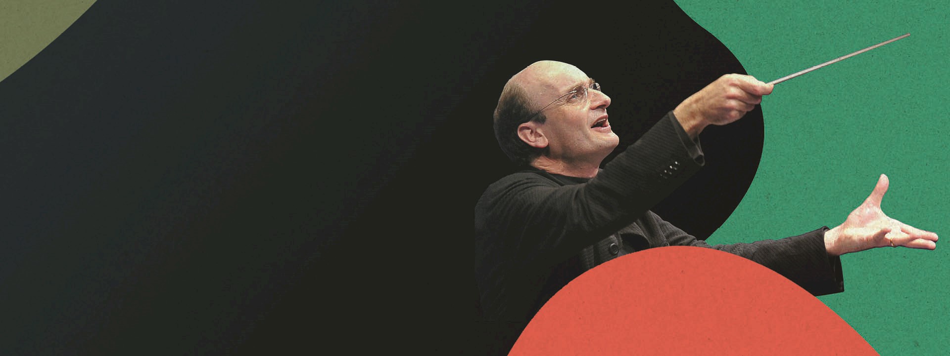 Principal Guest Conductor Andrew Manze holding a baton 