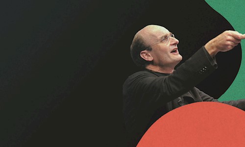 Principal Guest Conductor Andrew Manze holding a baton 